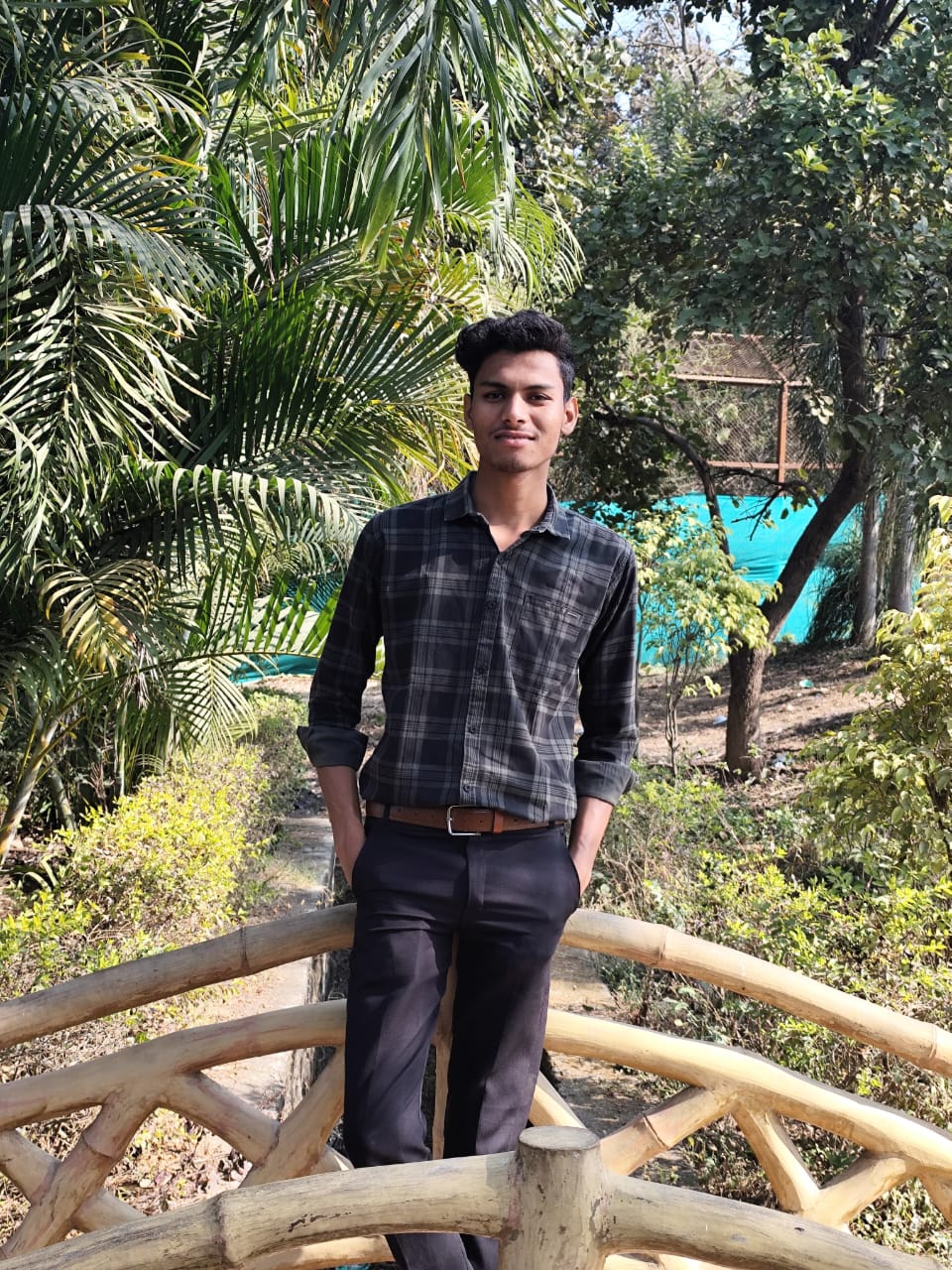 Two cotton t-shirts in black and mint green on a light background with cotton flowers.