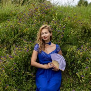 woman, blue dress, nature, summer, meadow flowers, fan, grass, field, blooming, carefree, recreational, vintage, retro, fashionable, romantic, joyful, colorful, relaxing, countryside