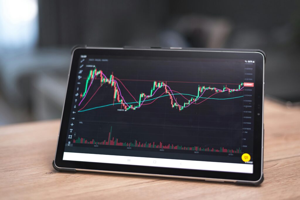 stock chart pattern Close-up of a tablet showing financial graphs and trends. Ideal for finance and technology themes.